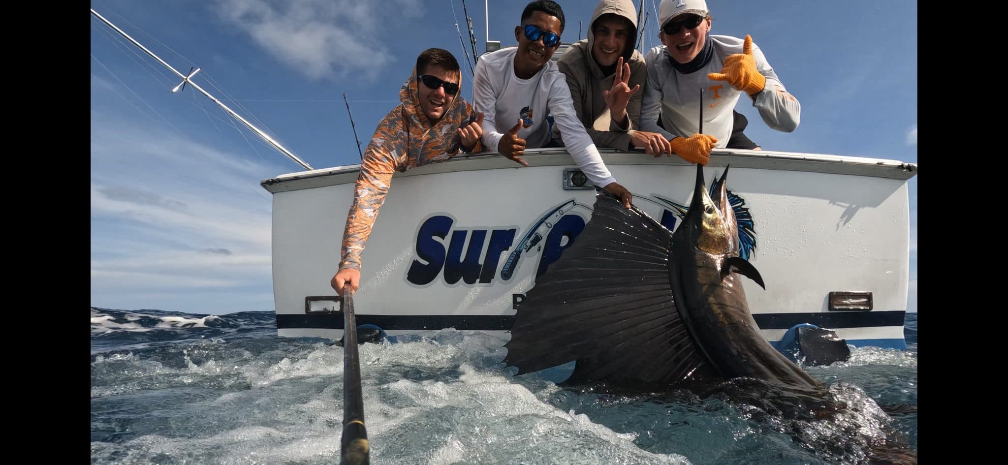 Anglers with a sailfish off the stern of Sur-Reel, The Big Buoys, Guatemala