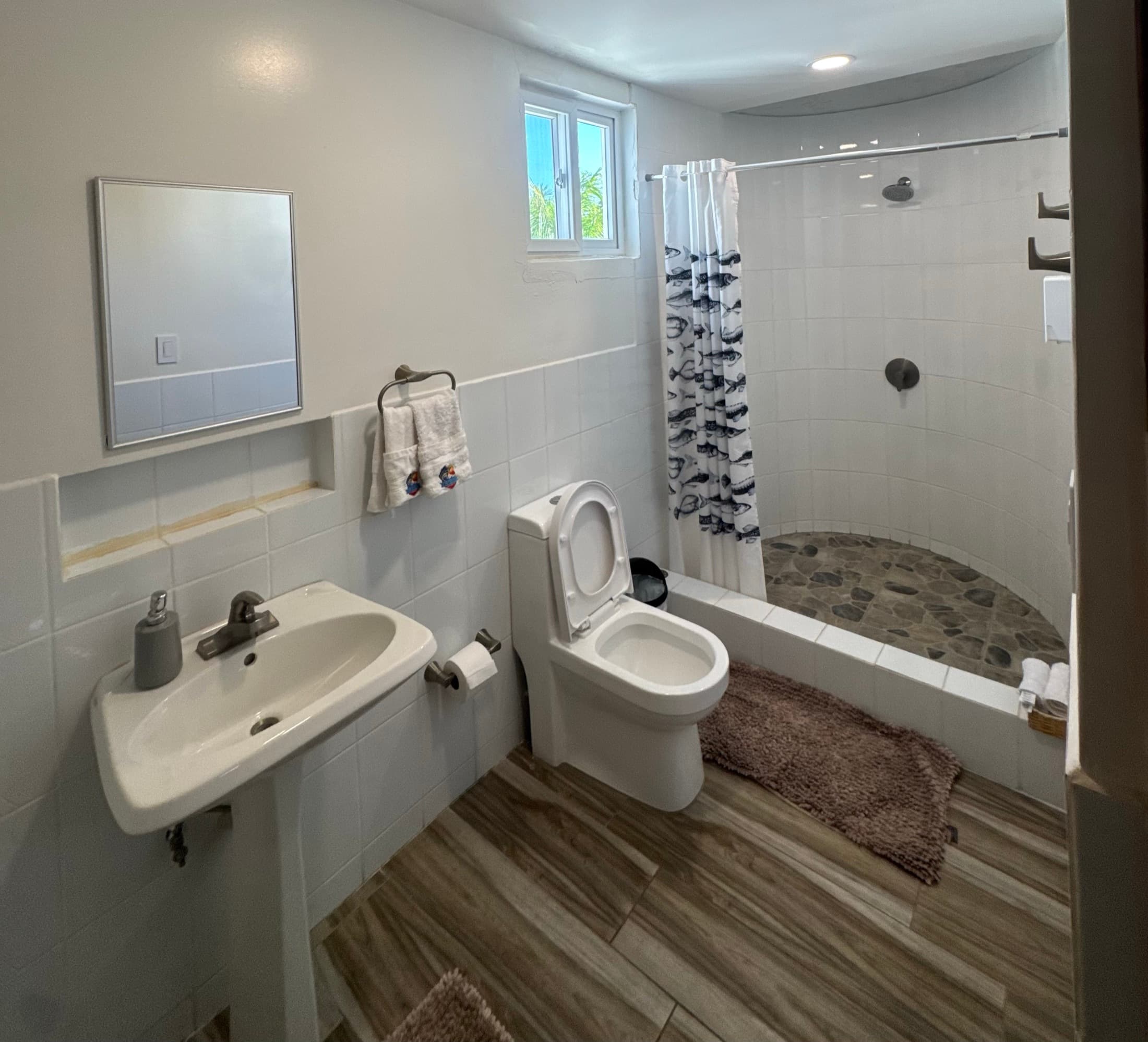 Modern bathroom with a walk-in shower in the Big Buoys villa, Puerto San José, Guatemala