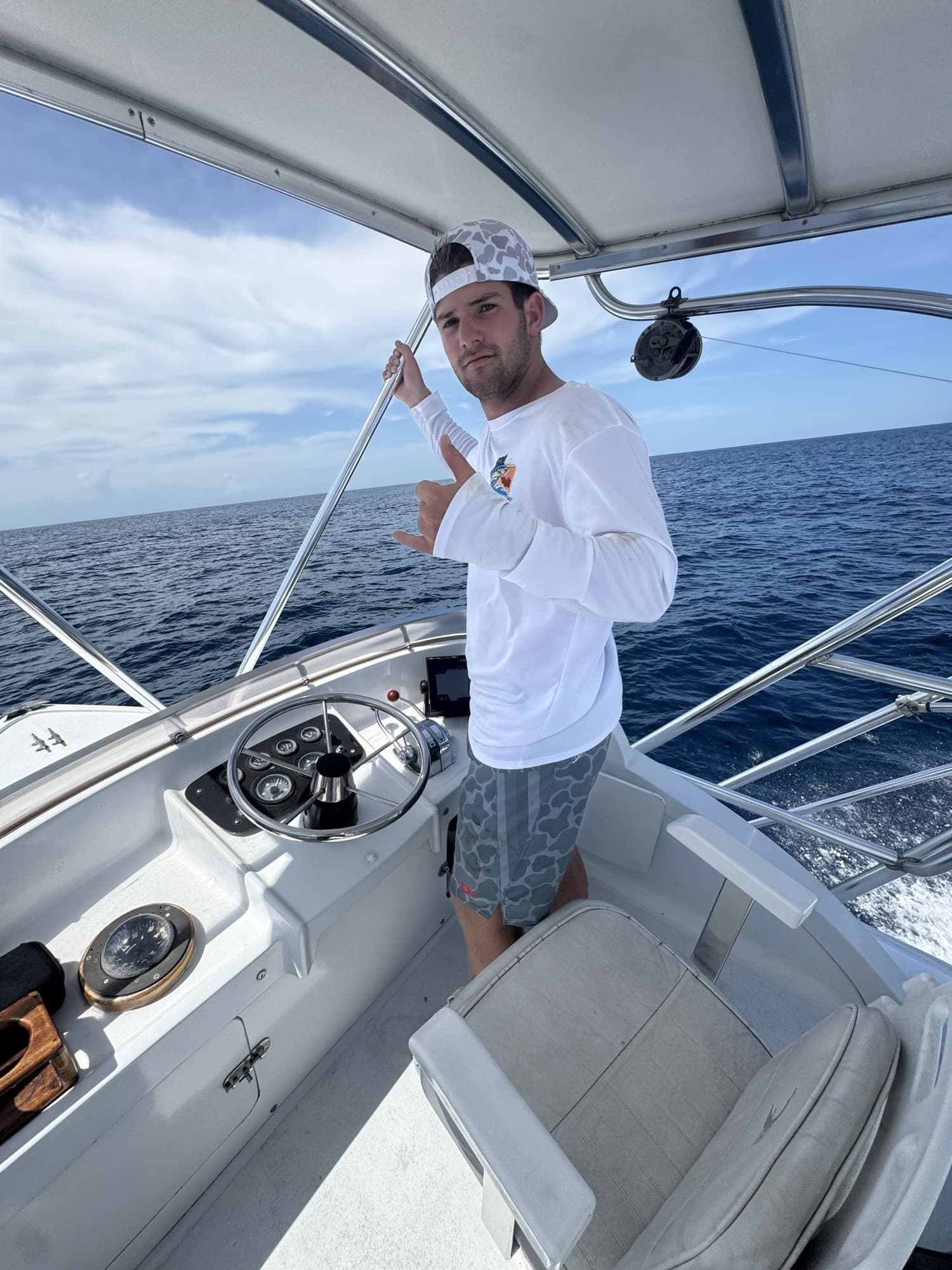 Max Hawkinson, Big Buoys owner and captain, at the helm in Puerto San José, Guatemala